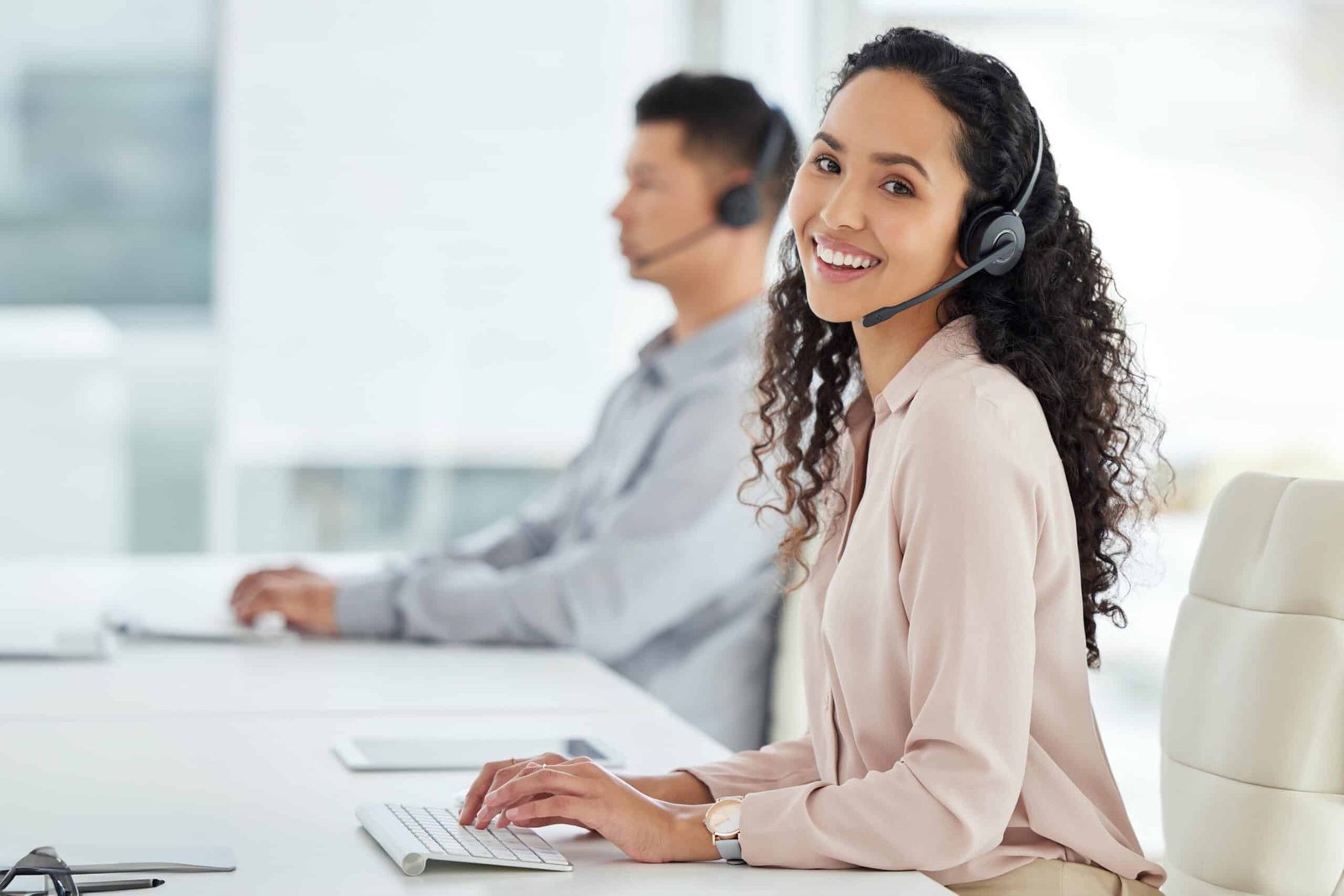 Young black and caucasian woman having good time, drinking fresh