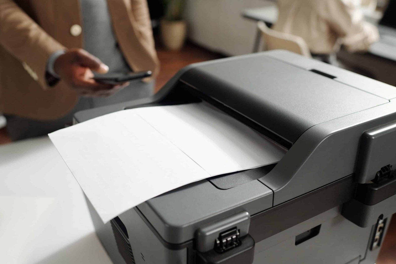 Young black and caucasian woman having good time, drinking fresh